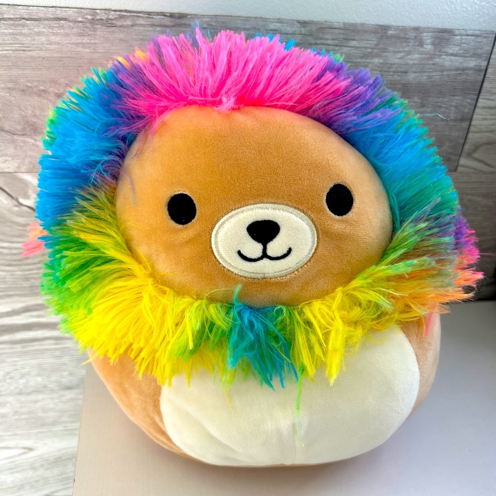 Lion squishmallow with rainbow mane, and tail